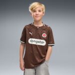 Camiseta de fútbol para niño del St. Pauli, primera equipación de la temporada 26/27. Producto oficial para pequeños fans.