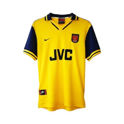 Camiseta retro Arsenal 1996/97 segunda equipación amarilla y azul marino — vista frontal en maniquí