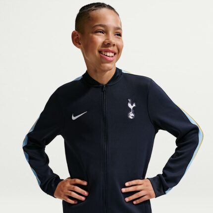 Chándal oficial para niño del Tottenham Hotspur temporada 26/27. Conjunto de chaqueta y pantalón para los jóvenes fans de los Spurs.