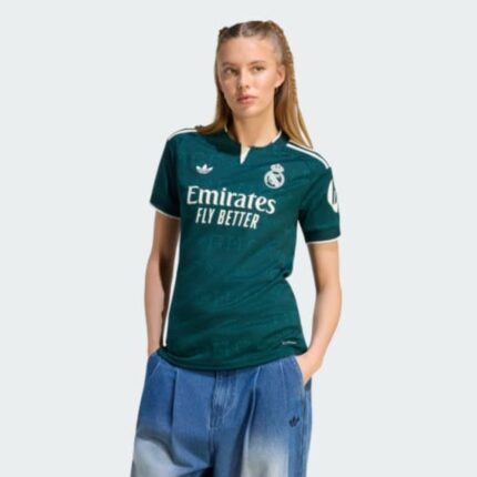 Camiseta de mujer del Real Madrid, segunda equipación visitante para la temporada 26/27. Producto oficial de adidas.