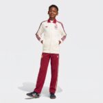 Chándal para niño de la segunda equipación de España. Conjunto de chaqueta y pantalón del uniforme visitante de la selección.