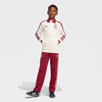 Chándal para niño de la segunda equipación de España. Conjunto de chaqueta y pantalón del uniforme visitante de la selección.