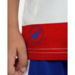 Primera equipación del Granada CF para niños temporada 2026-27. Conjunto de camiseta y pantalón oficial para los más pequeños.